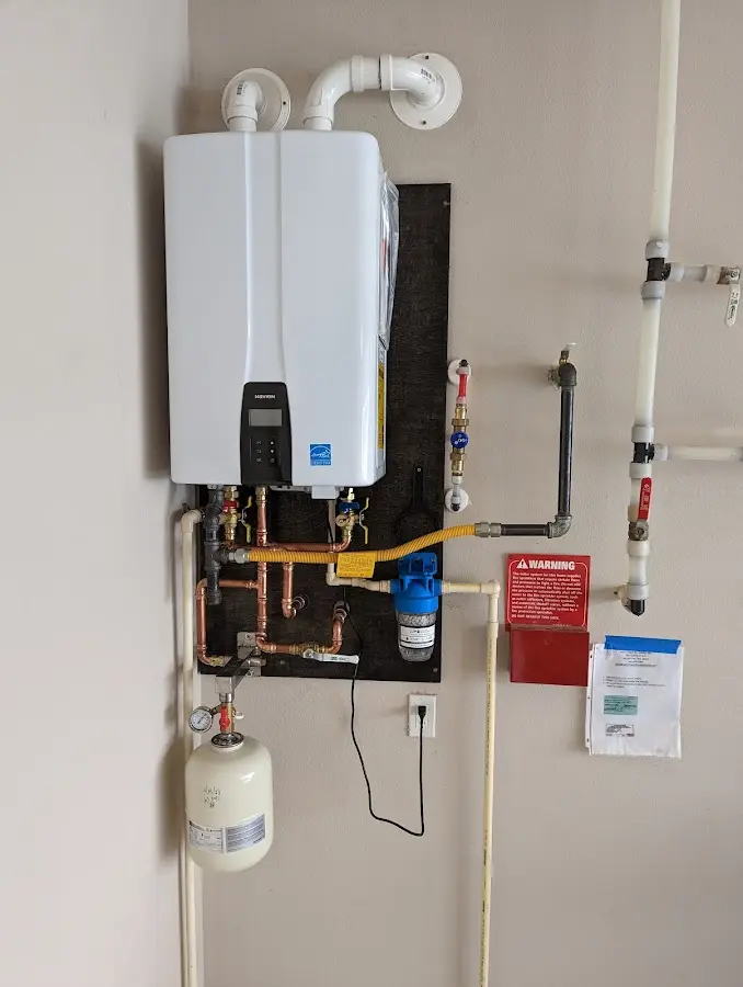 Professional plumber installing copper piping in a Sweetwater home